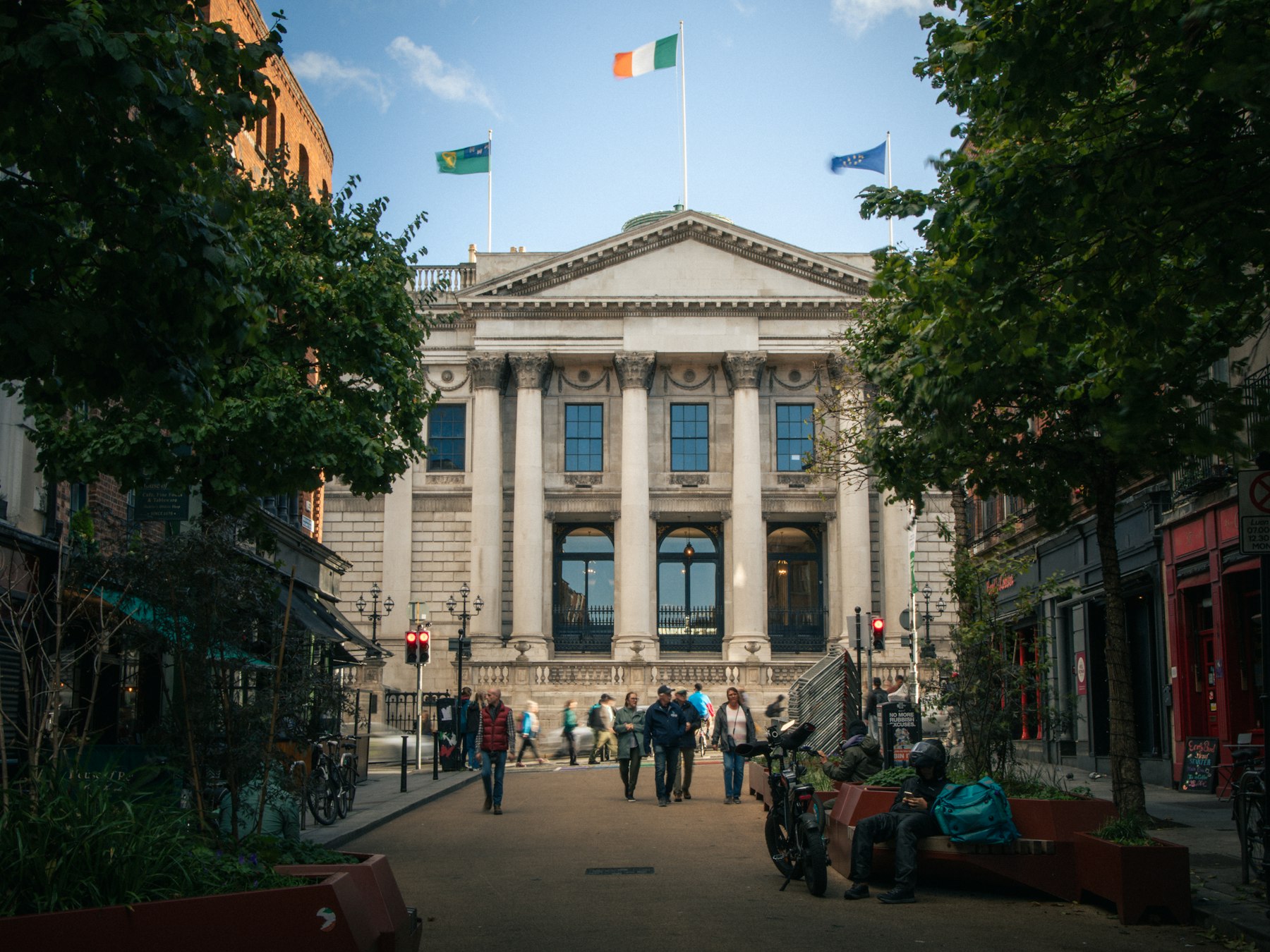 People walking towards the Bank of Ireland building in Dublin