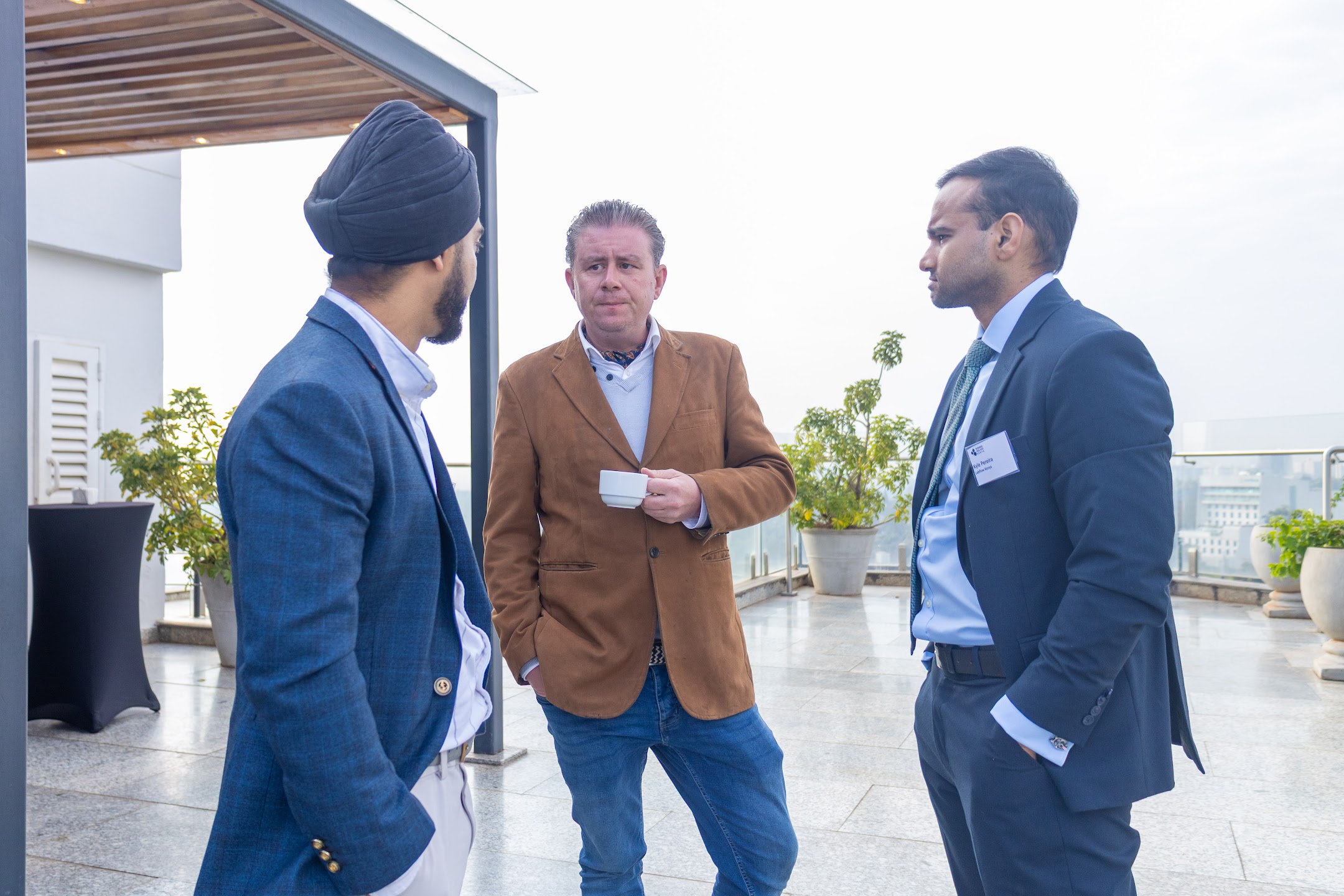 Business guests meeting on a rooftop terrace